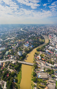 Aerial view of cityscape against sky