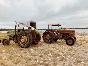 Tractor on field against sky