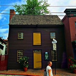 Woman standing in front of building