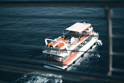 High angle view of people on boat sailing in sea