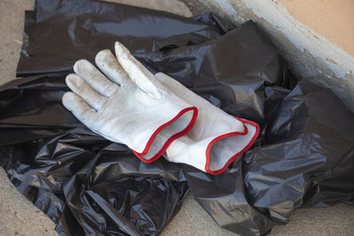 High angle view of shoes on garbage