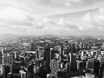 Aerial view of cityscape against sky