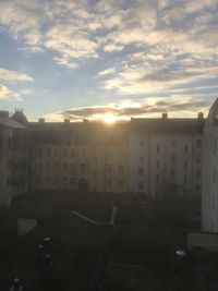 High angle view of buildings against sky during sunset