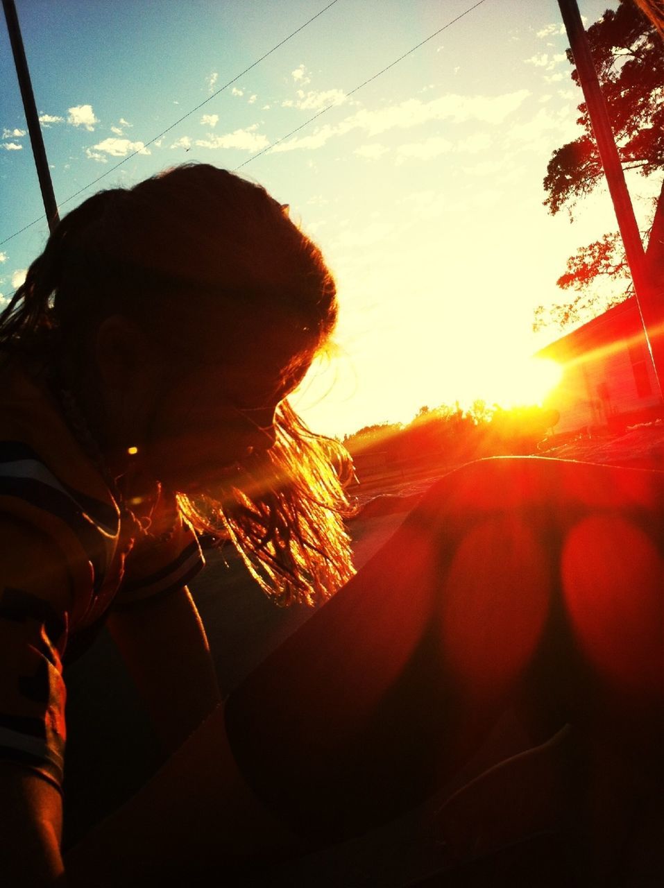 sun, sunset, sky, sunbeam, sunlight, lens flare, silhouette, nature, cloud, orange color, tranquility, close-up, beauty in nature, back lit, cloud - sky, outdoors, one person, scenics, part of, tree