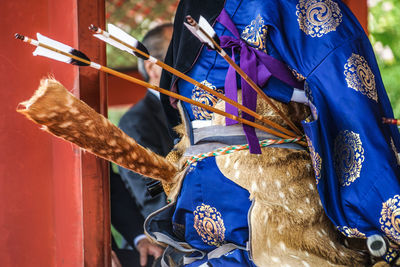 Low section of woman wearing traditional clothing