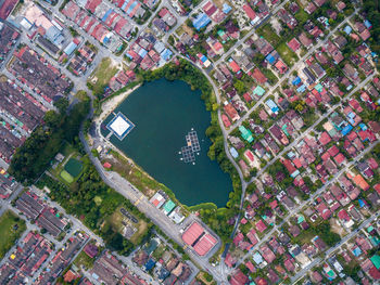 High angle view of canal amidst buildings in city