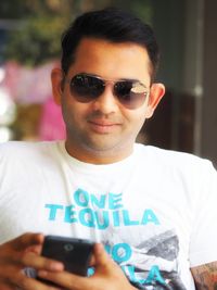 Portrait of young man wearing sunglasses