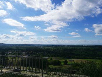 Scenic view of landscape against cloudy sky