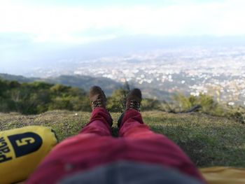 Low section of man lying on ground