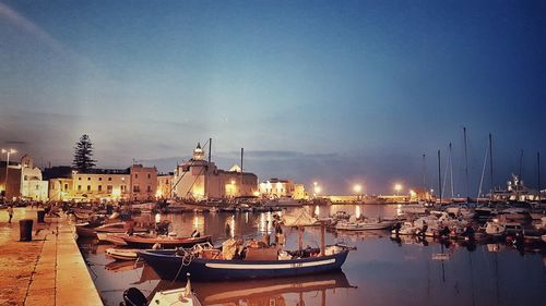 Boats moored at harbor