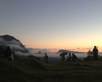 Scenic view of landscape against sky at sunset
