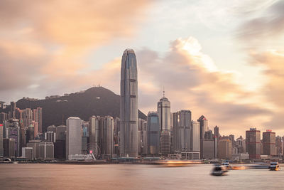 Modern buildings in city at sunset