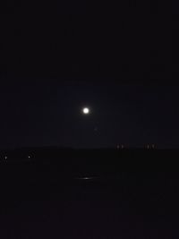 Scenic view of sea against sky at night