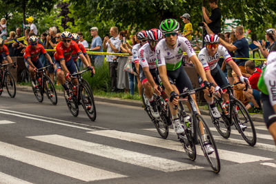 People riding bicycles on road