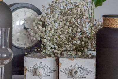 Close-up of flower vase on table at home