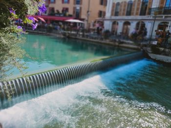 View of swimming pool by canal