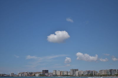 Low angle view of buildings against blue sky