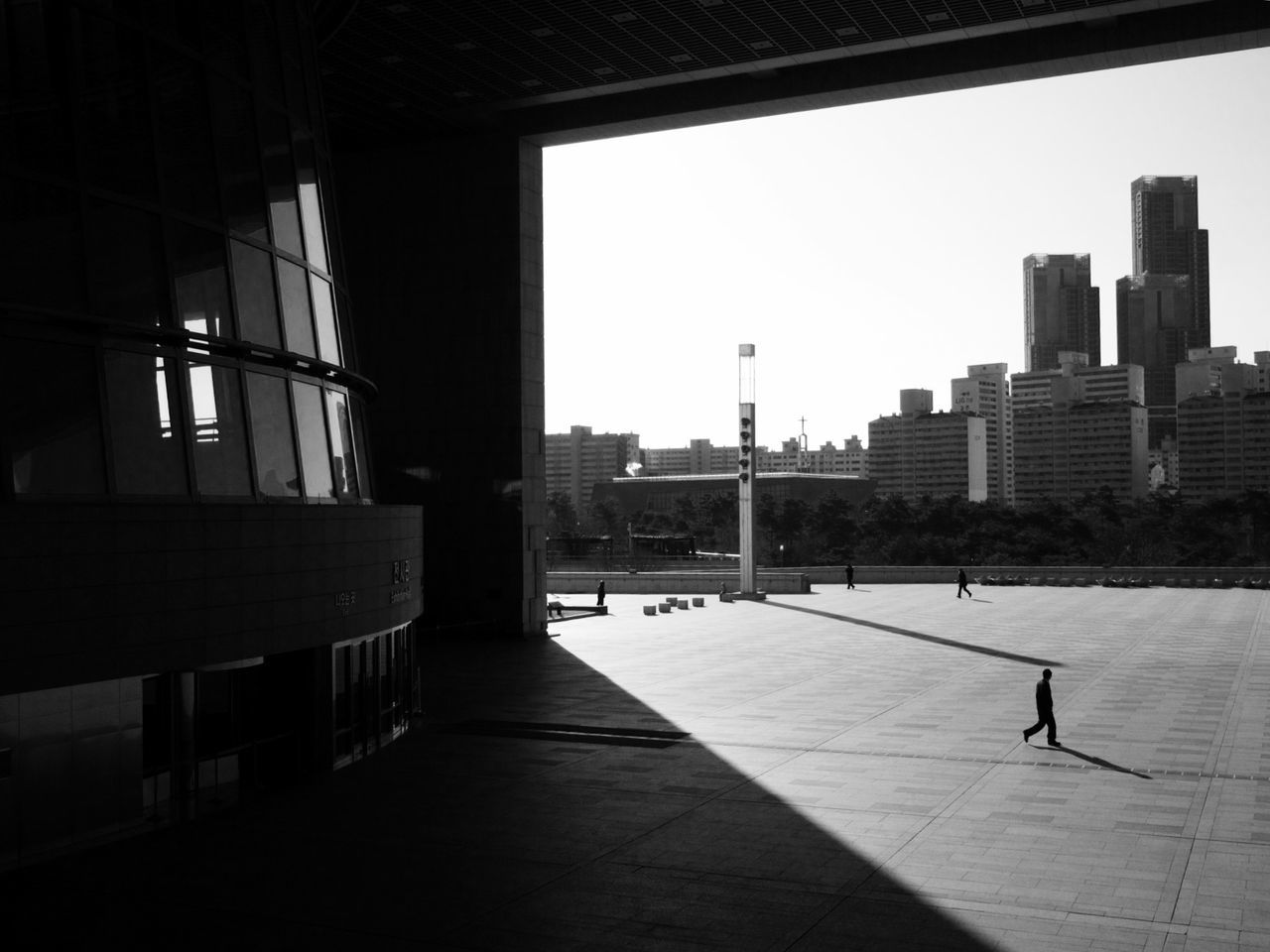 architecture, built structure, building exterior, city, indoors, building, clear sky, window, sunlight, modern, office building, city life, cityscape, residential building, residential structure, empty, glass - material, shadow, sky, flooring