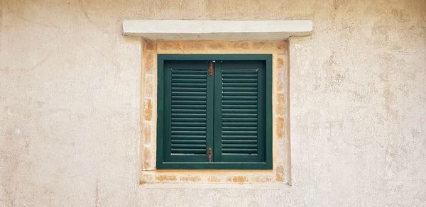 Closed window of old building