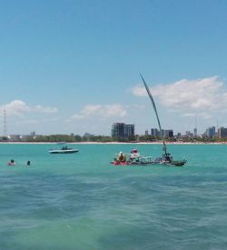 Boats sailing in sea