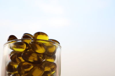 Close-up of glass bottle against white background