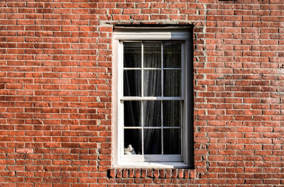 Full frame shot of window on wall of building