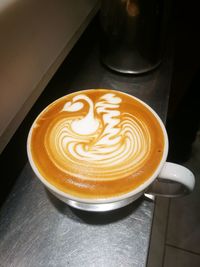 Close-up of cappuccino on table