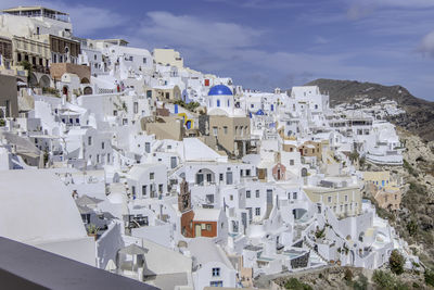 Santorini, greece, may 4, 2024. traditional village houses with blue dome