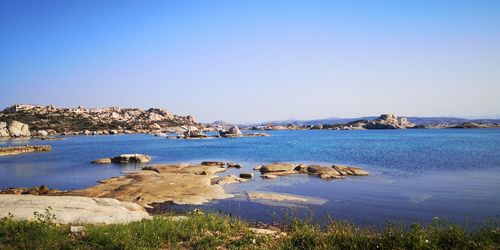 Scenic view of sea against clear blue sky