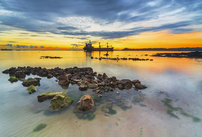 Scenic view of sea against sky during sunset