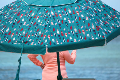 Portrait of woman holding umbrella