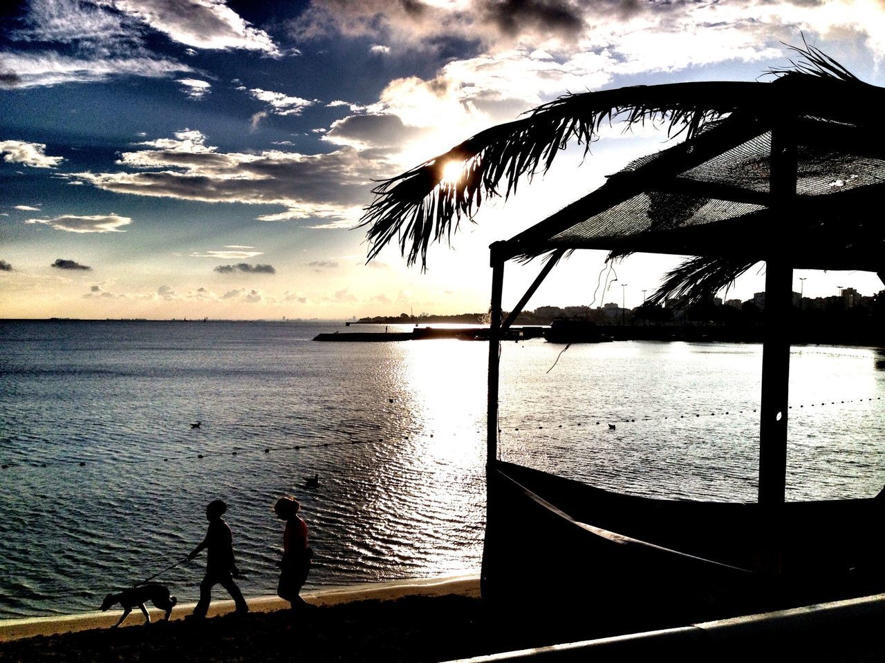 water, sea, silhouette, sky, sunset, horizon over water, cloud - sky, scenics, beauty in nature, leisure activity, tranquil scene, tranquility, lifestyles, nature, men, beach, cloud, idyllic