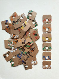 Bread tags made of recycled cardboard on white background 