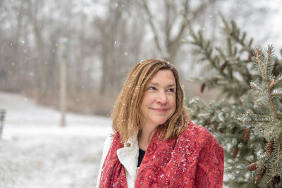 Portrait of smiling young woman in winter