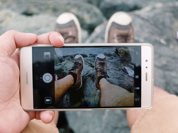 Close-up of man using mobile phone