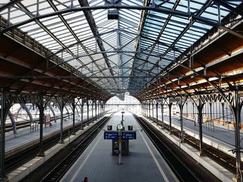 Train at railroad station against sky