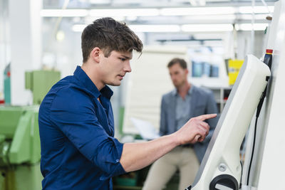 Side view of a man working