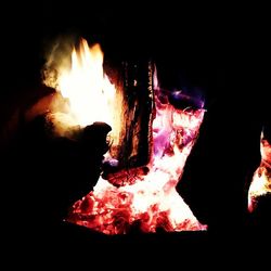 Close-up of fire in dark room