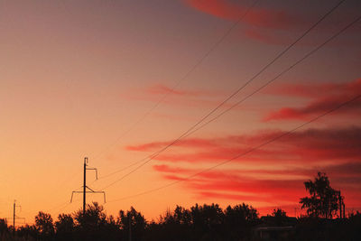 Silhouette trees against sky during sunset