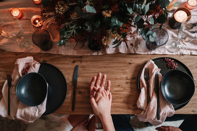 Directly above shot of woman preparing food on table