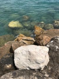 High angle view of rocks at sea shore