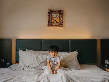 Young woman sleeping on bed at home