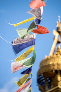 Low angle view of man against blue sky