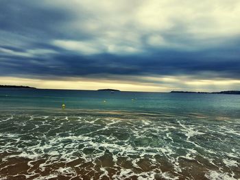 Scenic view of sea against cloudy sky