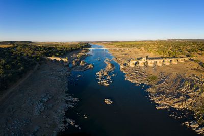 High angle view of river against clear blue sky