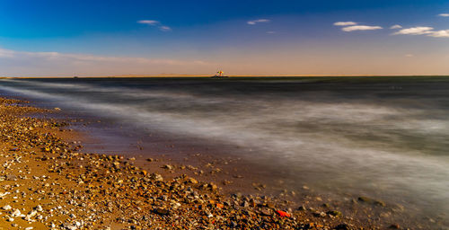 Scenic view of sea against sky during sunset