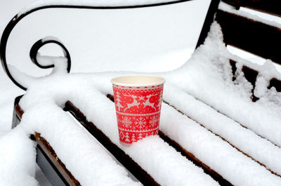 Close-up of snow covered coffee cup