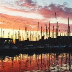 Sailboat in sea at sunset