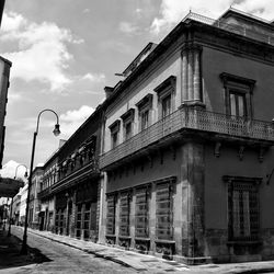 Street amidst buildings against sky