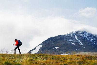 Woman hiking in mountains  on the move